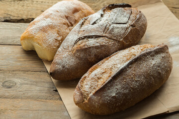 Different bread type on wooden table, prepared for people with special diet, gluten free bun