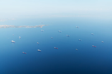 A top view from an airplane of the beautiful city Istanbul Harbor with group of freighter ships.Import and export concept.