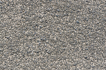 Grunge asphalt structure texture. Closeup granular noise background. Street grain pattern.
