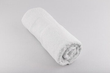 Fototapeta na wymiar cotton soft white towel isolated on white/gray background