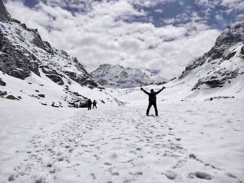 Manali, India - June 14th 2019: Man Having Sense of Achievement when he reach his peak of Humpta Pass trek in Indian Himalayan Mountains.