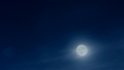 Fototapeta na wymiar Full moon at night with many blue skies and stars