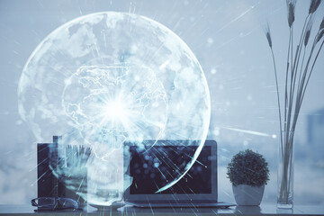 Double exposure of business theme icons and work space with computer background. Concept of success.