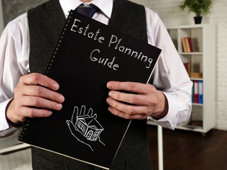 Business concept about Estate Planning Guide with sign on the page.