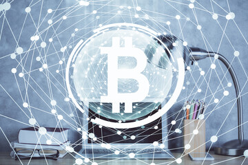 Double exposure of blockchain and crypto economy theme hologram and table with computer background. Concept of bitcoin cryptocurrency.