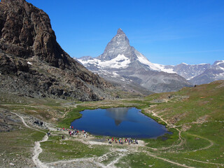 Matterhorn seen from the mountain climbed by the train in Zermatt on a sunny day.