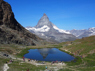 Matterhorn seen from the mountain climbed by the train in Zermatt on a sunny day.