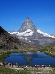 Matterhorn seen from the mountain climbed by the train in Zermatt on a sunny day.