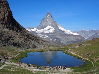 Matterhorn seen from the mountain climbed by the train in Zermatt on a sunny day.