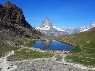 Matterhorn seen from the mountain climbed by the train in Zermatt on a sunny day.