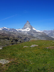 Matterhorn seen from the mountain climbed by the train in Zermatt on a sunny day.