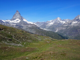Matterhorn seen from the mountain climbed by the train in Zermatt on a sunny day.
