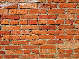 THE RED Weathered stained old brick wall.