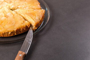 Homemade apple pie on a stone countertop. Appetizing breakfast, author's recipe.