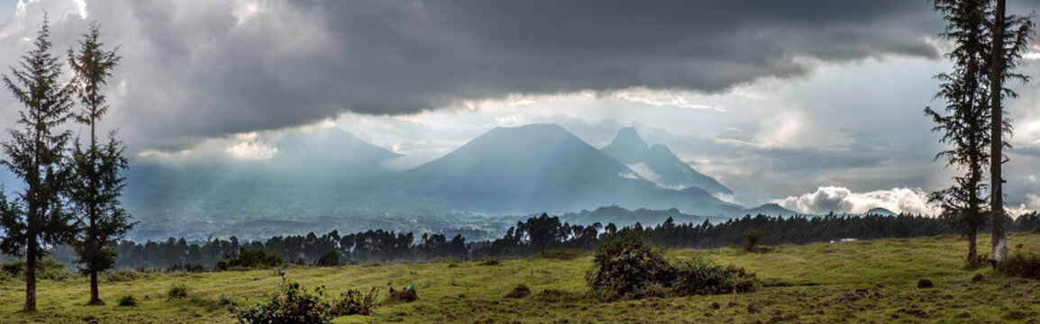 Three volcanoes seen from Rwanda in the border area with the Democratic Republic of Congo: mounts Karisimbi, Bisoke & Mikeno (from left to right).