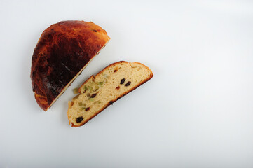Norwegian Christmas cake with raisins and candied peel.  Round loaf with a slice on the side....
