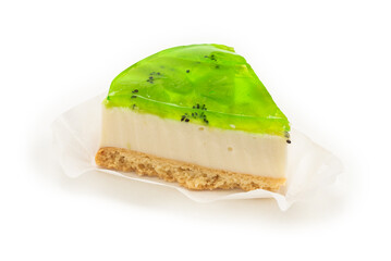 Piece of kiwi cheesecake isolated on white.
