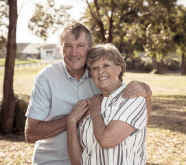 Portrait of elderly senior couple enjoying retirement lifestyle feeling happy aging together