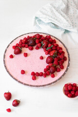 Raspberry dessert, cheesecake with fresh raspberries. Vertical photo