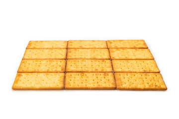 Cracker with salt isolated on white.