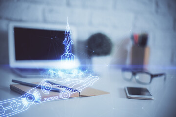 Desktop computer background in office and start up theme hologram drawing. Double exposure. Startup...