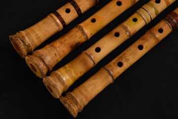 Shakuhachi flute, Shakuhachi is Japanese bamboo flute, on black background.