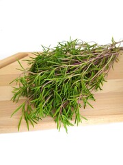 Bunch of rosemary herbs on the wooden background