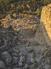 ruins of the castle at the top of the hill at sunset