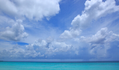 Fototapeta na wymiar Caribbean sea and clouds sky. Travel background.