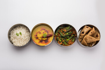 Indian Lunch box or tiffin - Spicy Ladies Finger, dal fry, rice and chapati