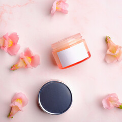 Opened cosmetic cream jar mockup on pink background with petals. Skin care beauty product packaging design.