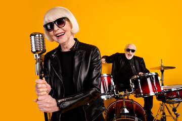 Close-up portrait of his he her she nice attractive cheerful cheery grey-haired couple famous...