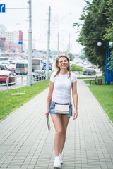 Fototapeta premium Young woman using tablet outdoor