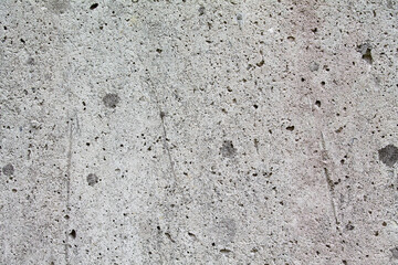 Texture of a dirty concrete wall with signs of age.