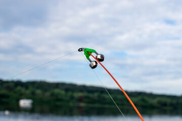 A bell on a fishing rod.  Fishing tackle. River View.
