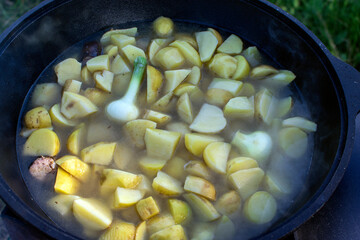 Fototapeta na wymiar vegetables cooked in a cauldron