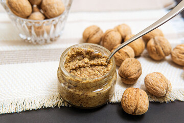 Raw organic walnut butter and fresh nuts.