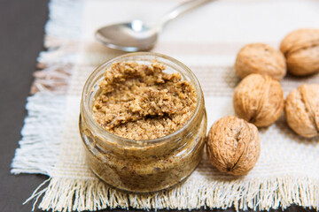 Raw organic walnut butter and fresh nuts.