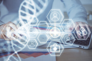 DNA hologram with businessman working on computer on background. Concept of bioengineering. Double...