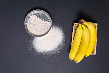 banana flour on a black background top view © Алексей Филатов