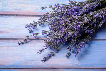 Lavender aromatherapy , essential oil and lavender flowers on wooden table.