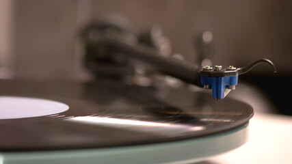 Fototapeta na wymiar Gramophone with a vinyl record. Close-up view of vinyl player.