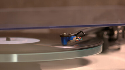 Nostalgic music is playing by the vinyl player. Retro music in vinyl.