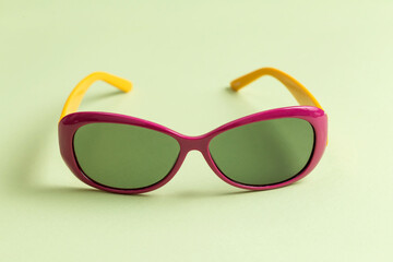 Sunglasses on a green background