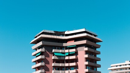 Pink and white buildings with a blue sky background (Pesaro, Italy, Europe)