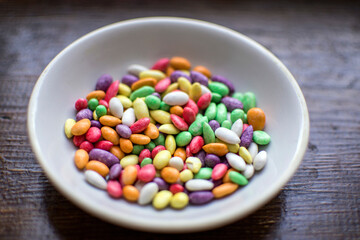 multi-colored candies in a plate close-up