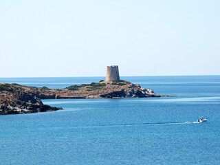 Sardinia View of the sea in front of Porto Budello, Teulada, in the background a watchtower