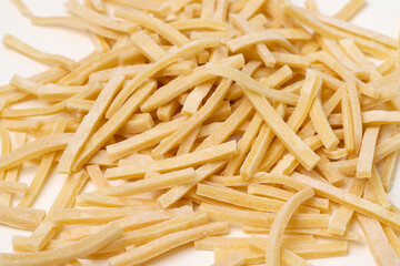 Staying at home with your family and preparing fresh home-made pasta (tagliatelle)