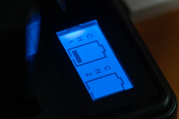 Luminous indicator of the camera battery charger. process of charging the camera's batteries