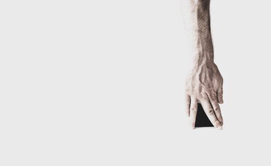 hand with fingers apart on a light background, between fingers black background